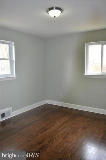 6022 Brunswick Street Springfield, VA 22150 - Photo 22 of 24 an empty room with wooden floor and windows
