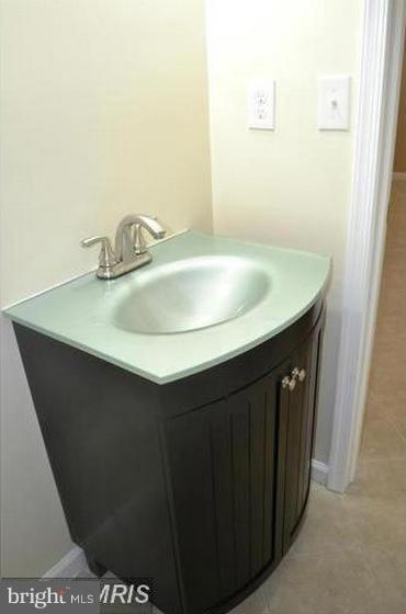 6022 Brunswick Street Springfield, VA 22150 - Photo 23 of 24 a sink with a mirror