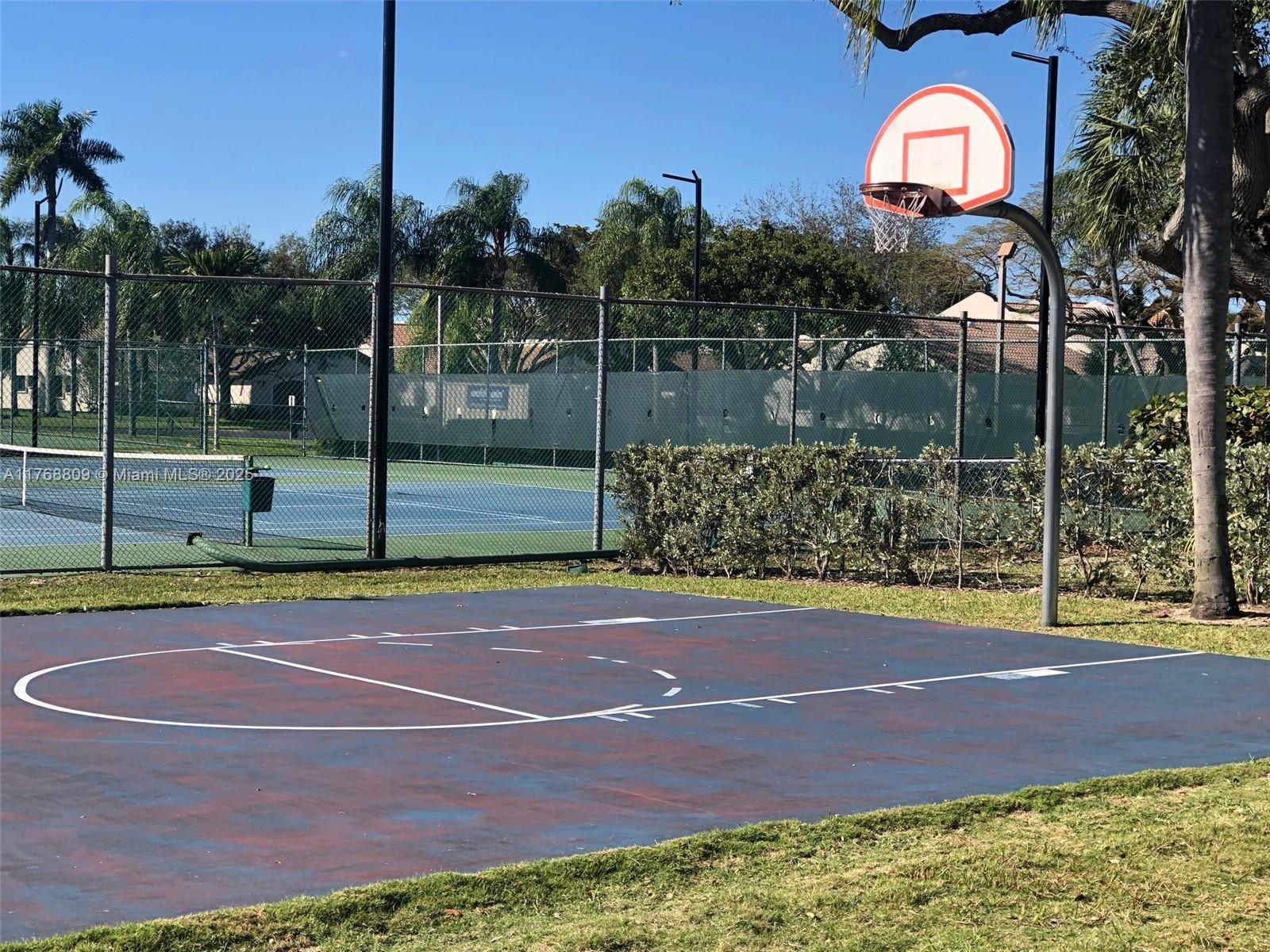 8589 Southwest 115th Place Miami, FL 33173 - Photo 7 of 13 a view of a tennis court