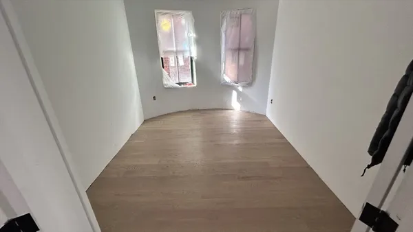 en empty room with windows