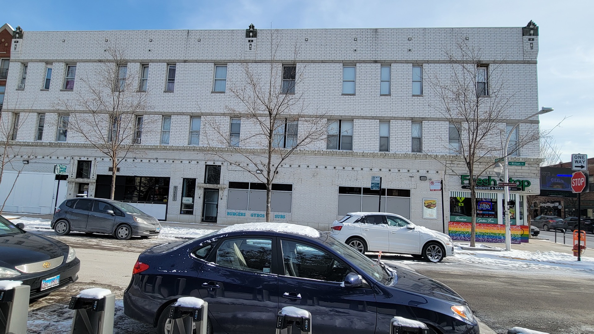 3207 North Wilton Avenue, Unit 2 Chicago, IL 60657 - Photo 1 of 14 a car parked in front of a building