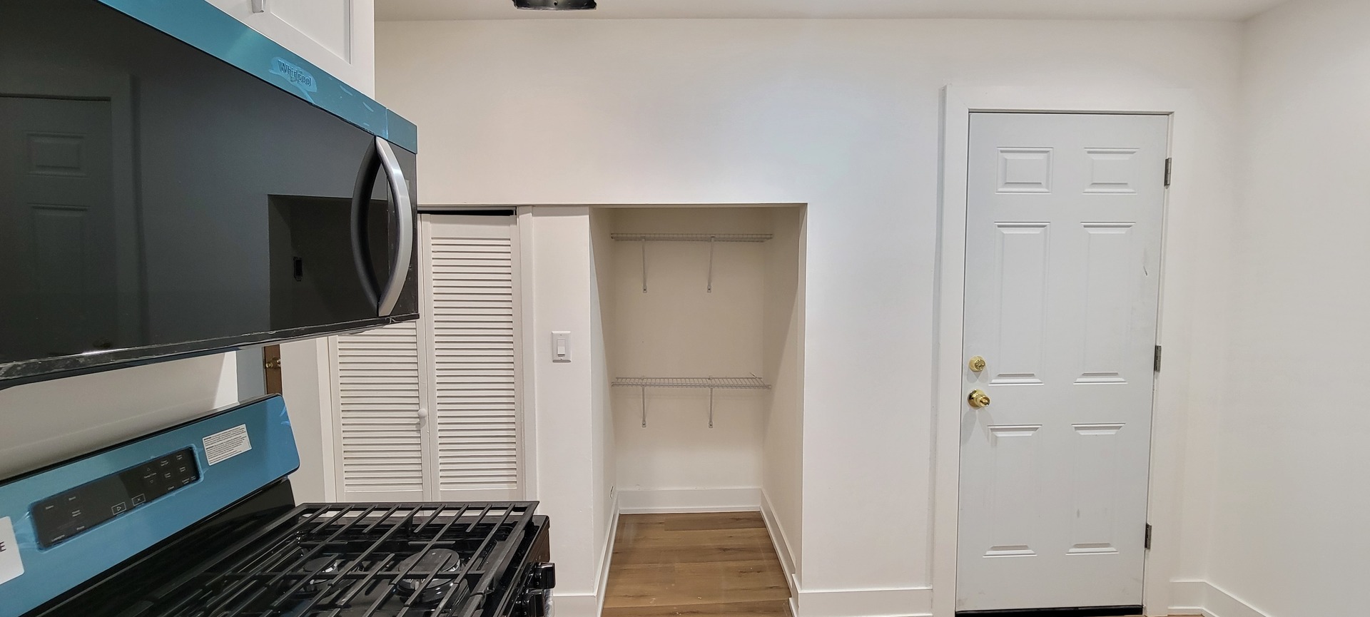 3207 North Wilton Avenue, Unit 2 Chicago, IL 60657 - Photo 12 of 14 a view of a livingroom with wooden floor and stairs