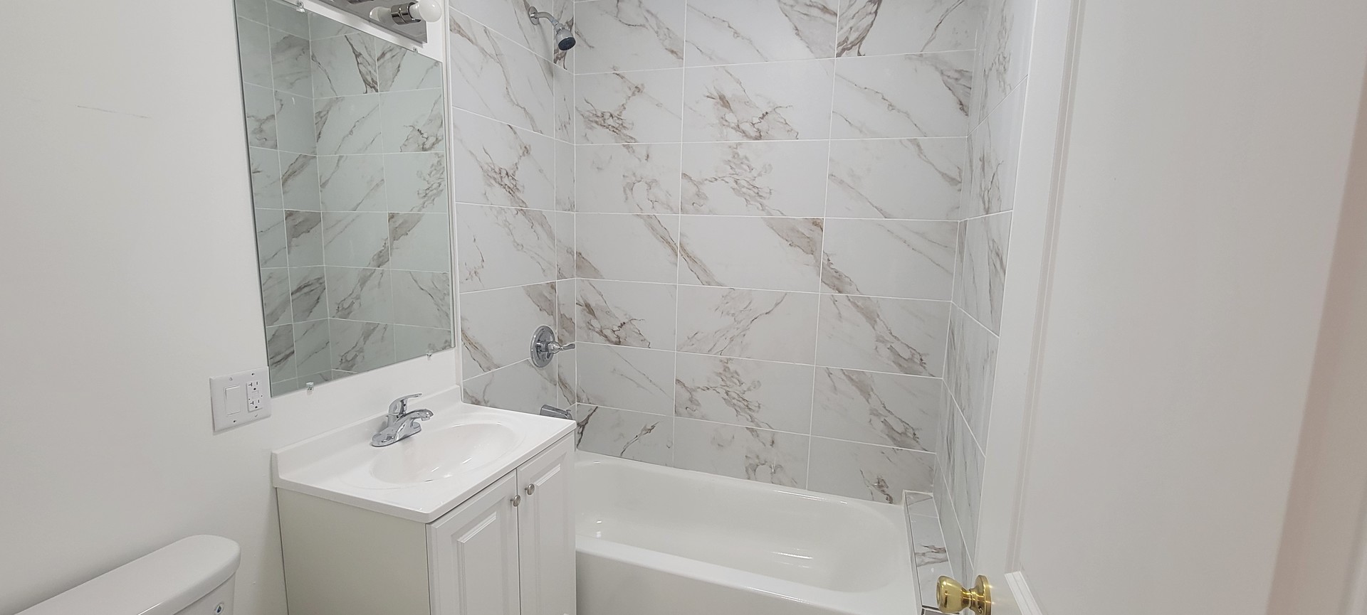 3207 North Wilton Avenue, Unit 2 Chicago, IL 60657 - Photo 13 of 14 a bathroom with a sink a toilet and shower