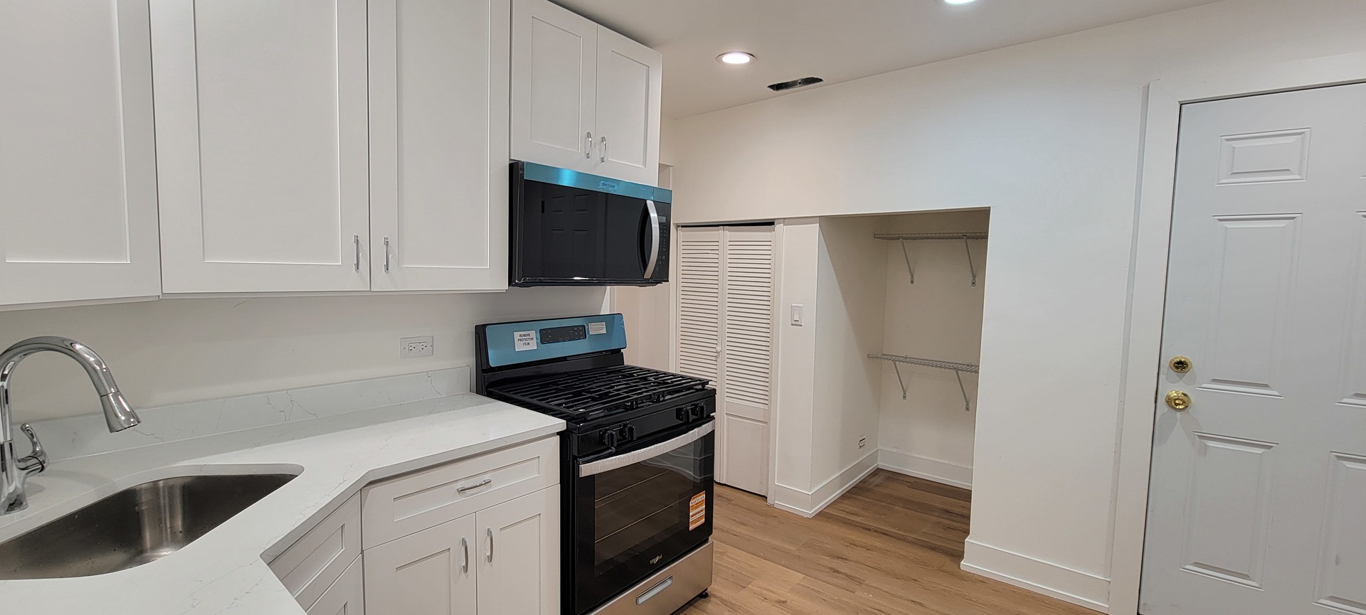 3207 North Wilton Avenue, Unit 2 Chicago, IL 60657 - Photo 10 of 14 a kitchen with stainless steel appliances a refrigerator stove and sink