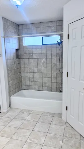 a bathroom with a double vanity sink and mirror