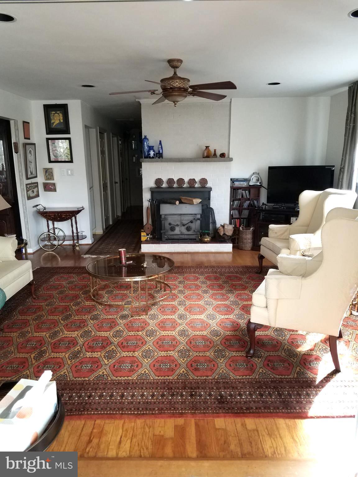 2990 Valley View Road Annapolis, MD 21401 - Photo 6 of 10 Huge living room with fireplace opens to sun room