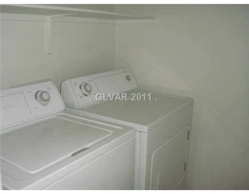 8959 Argus Reed Avenue Las Vegas, NV 89148 - Photo 11 of 15 Master Bedroom. laundry room