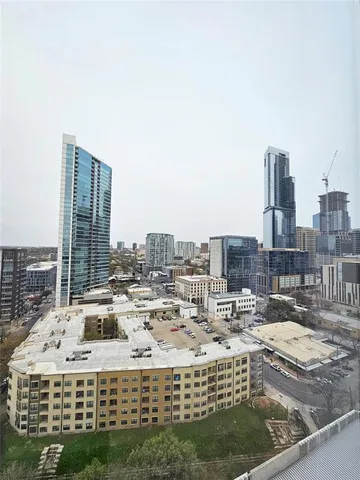 a view of roof with city view
