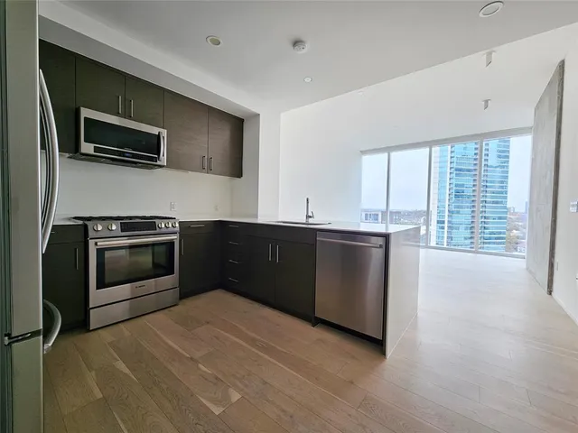 a kitchen with a stove and a microwave