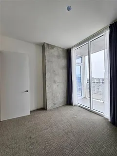 a view of an empty room with a balcony