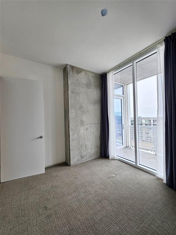 301 West Avenue, Unit 1603 Austin, TX 78701 - Photo 6 of 18 a view of an empty room with a balcony