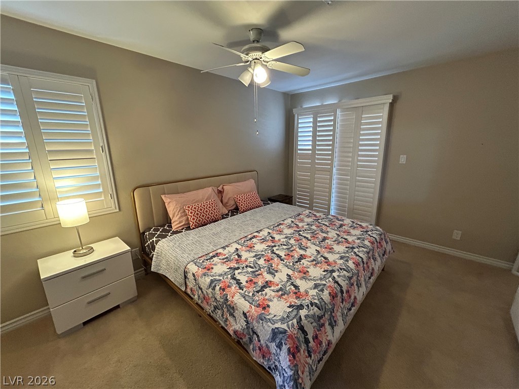 267 Westwind Road Henderson, NV 89074 - Photo 15 of 16 Plantation shutters adorn the window and closet of this well-lit bedroom.