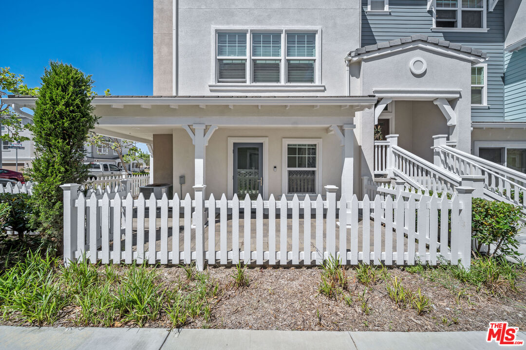 3763 Islander Walk Oxnard, CA 93035 - Photo 3 of 45 a front view of a house with a garden