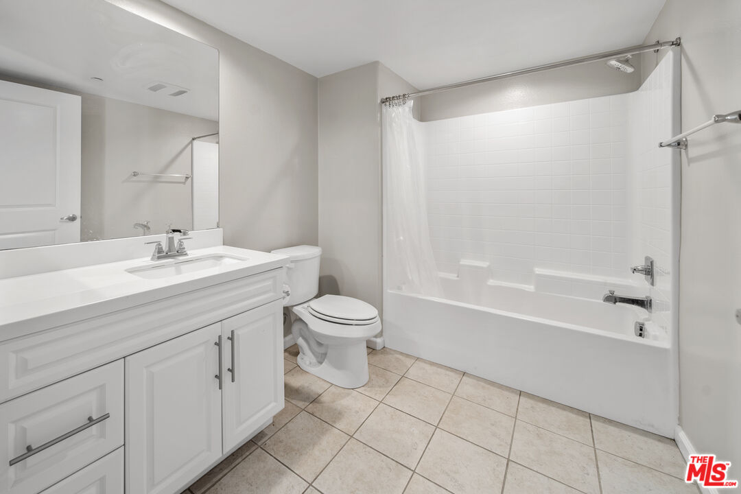 3763 Islander Walk Oxnard, CA 93035 - Photo 36 of 45 a bathroom with a sink a toilet and shower