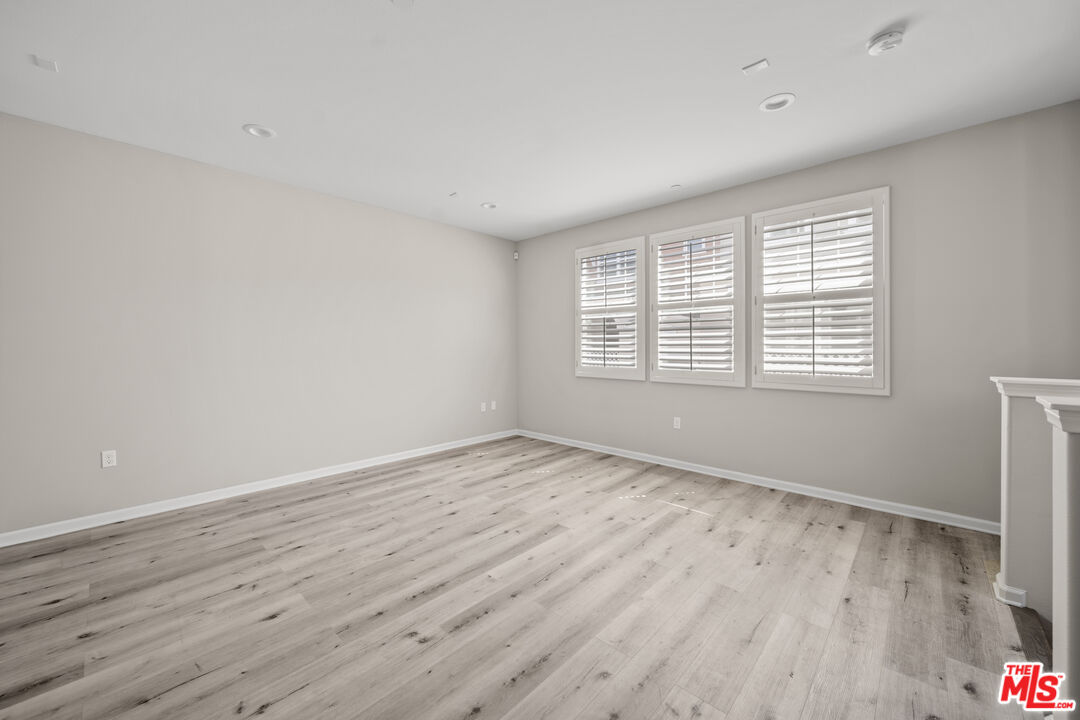 3763 Islander Walk Oxnard, CA 93035 - Photo 8 of 45 wooden floor in an empty room with a window