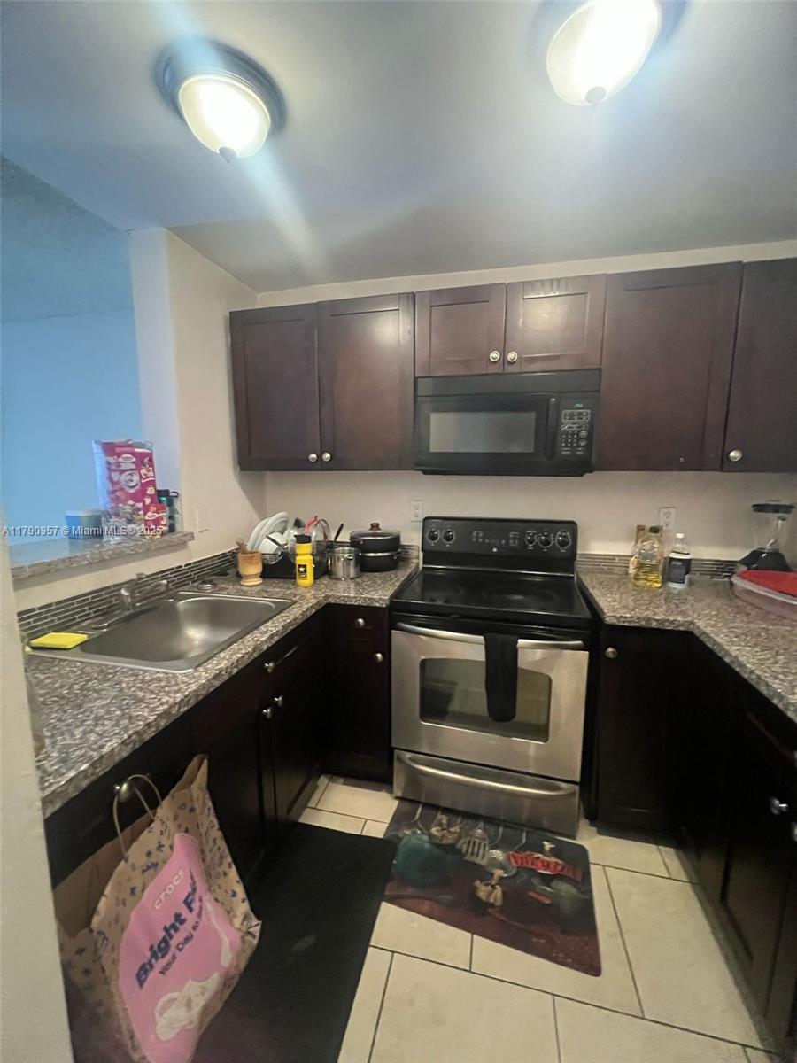 a kitchen with a stove and a sink
