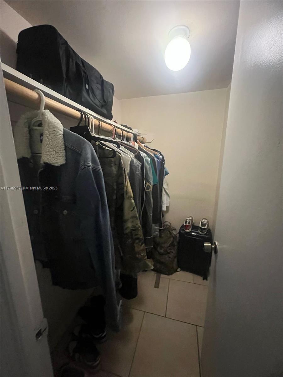 482 Northwest 165th Street, Unit A203 Miami, FL 33169 - Photo 6 of 6 a view of walk in closet