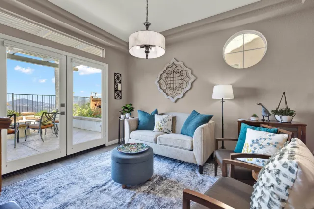 a kitchen with stainless steel appliances a stove a sink and white cabinets