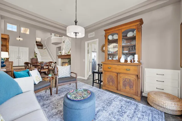 a living room with furniture and a table