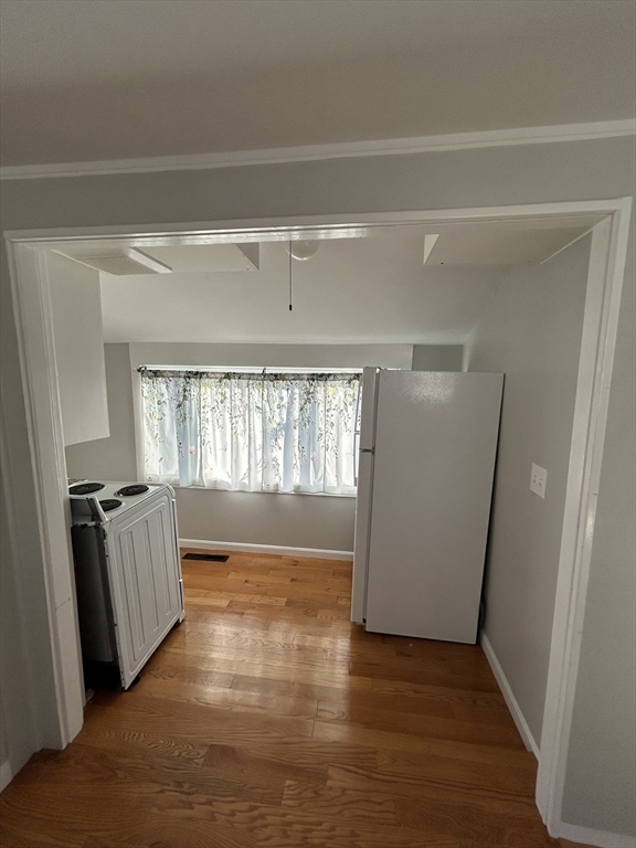 41 Union Street, Unit R Rockland, MA 02370 - Photo 5 of 9 a view of empty room with wooden floor and fan