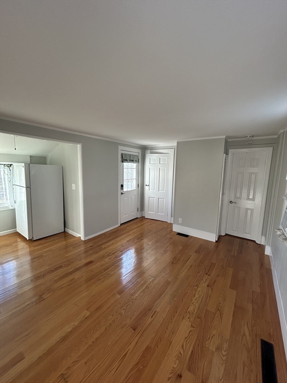 41 Union Street, Unit R Rockland, MA 02370 - Photo 6 of 9 a view of an empty room with window and wooden floor