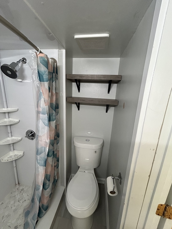 41 Union Street, Unit R Rockland, MA 02370 - Photo 9 of 9 a bathroom with a toilet and a shower