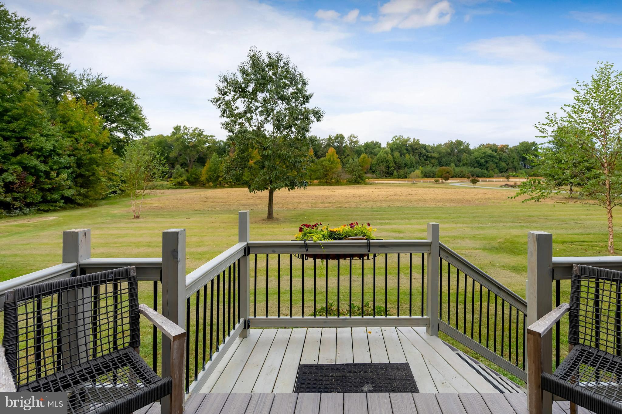 141 West Tomlin Station Road Mickleton, NJ 08056 - Photo 4 of 33 a view of a balcony with wooden floor and lake view
