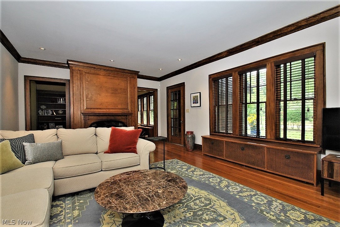 Large living room with natural woodwork, wood flooring and​​‌​​​​‌​​‌‌​‌‌​​‌​​​​‌​​​‌‌​‌‌‌ fireplace