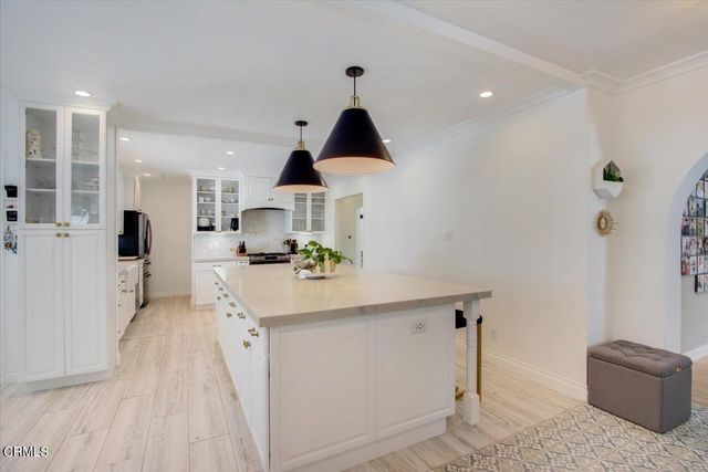 a reading room with furniture and a window