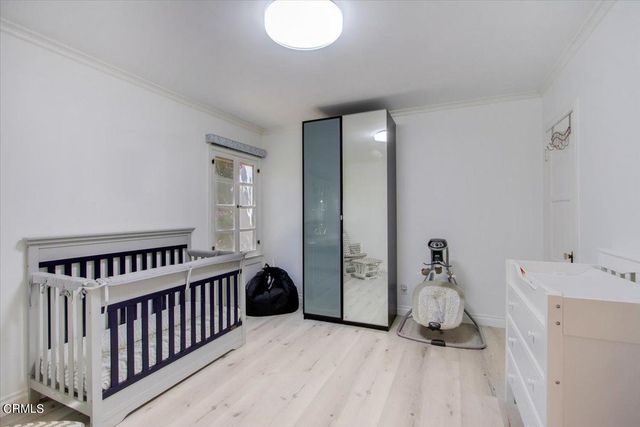 a front view of a house with sitting area