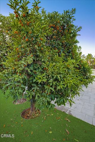 an aerial view of residential houses with city view