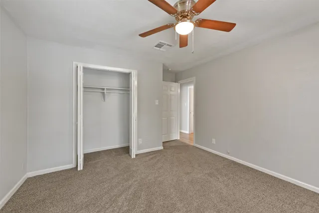 a bedroom that has a bed and a window