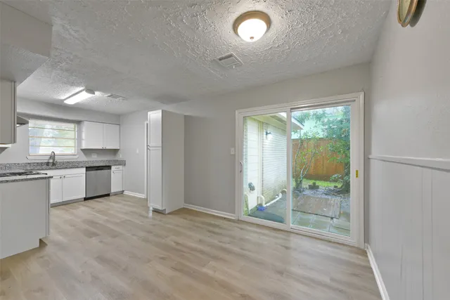 a view of kitchen with wooden floor