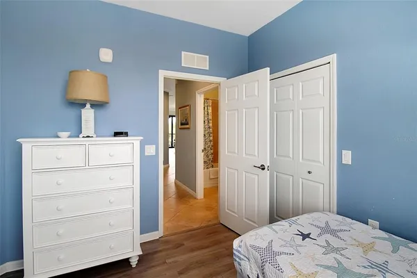 a bathroom with a shower curtain and a shower