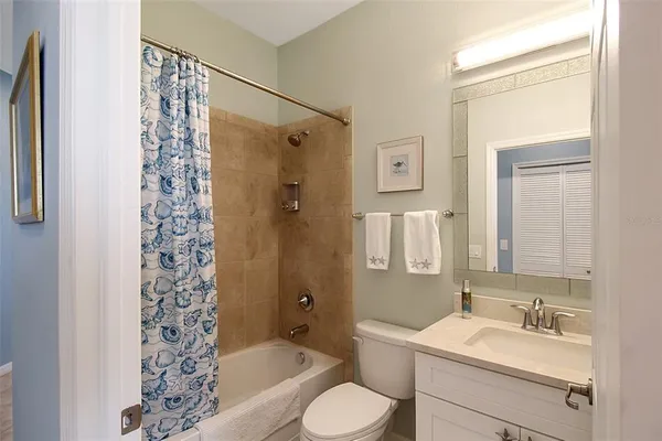 a kitchen with a sink and chairs