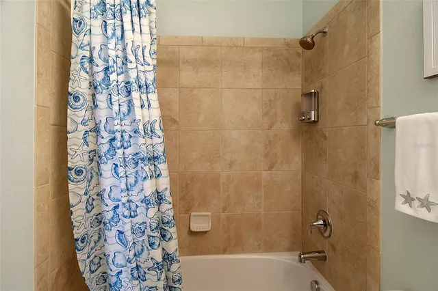 a view of a dining area with furniture and a large window