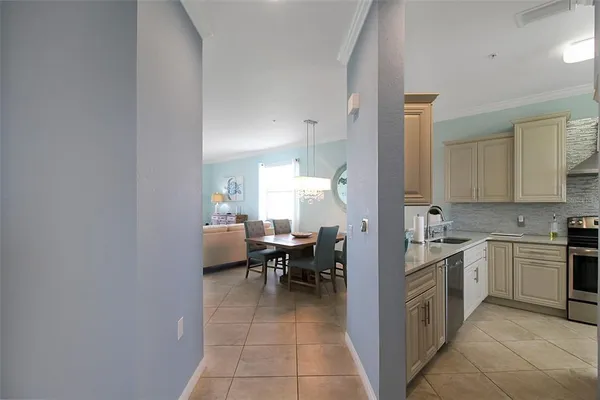 a kitchen with stainless steel appliances granite countertop a stove and a sink