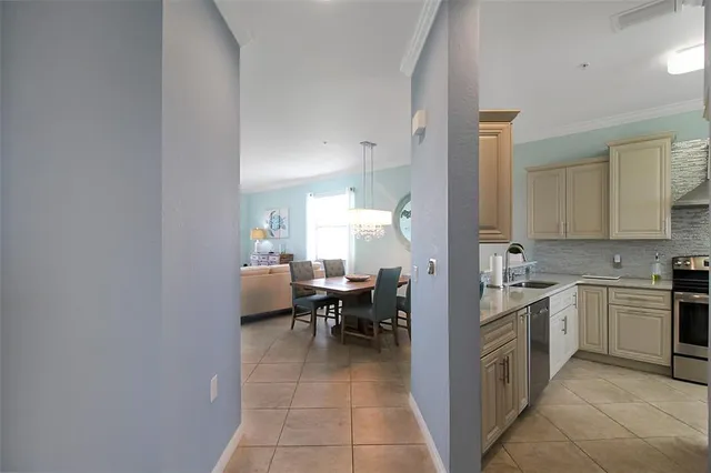 a kitchen with stainless steel appliances granite countertop a stove and a sink