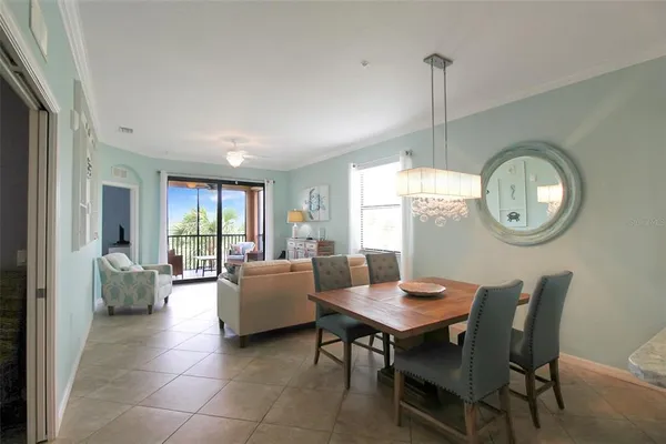 a view of a dining room with furniture and a mirror
