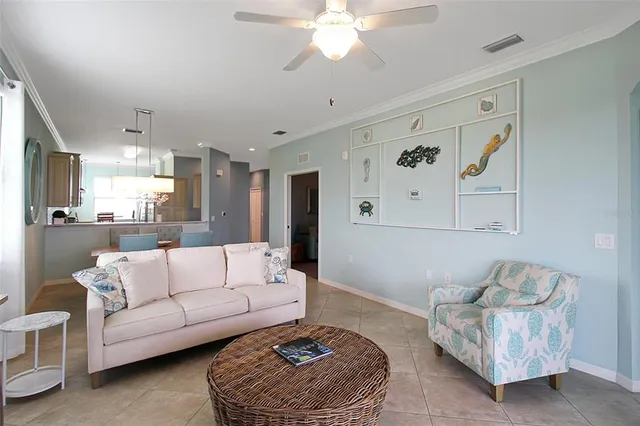 a living room with furniture a rug and a window