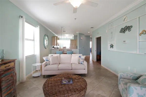 a balcony with furniture and a potted plant
