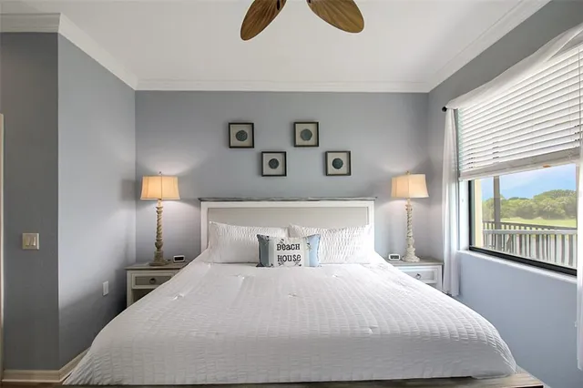 a bedroom with a bed and a television