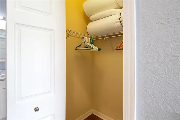 a bathroom with a granite countertop sink two mirror and shower