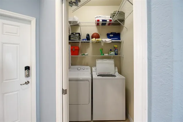 a view of a lake with houses in the back