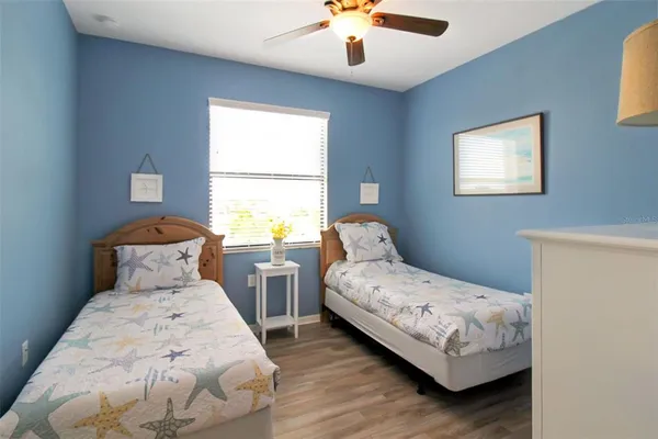 a bedroom with a bed and a lamp on table