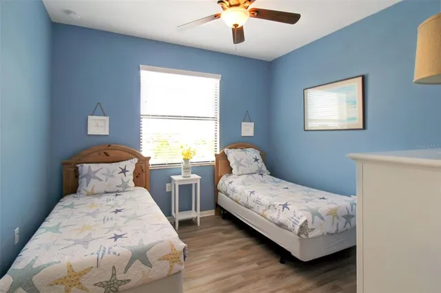 a bedroom with a bed and a lamp on table