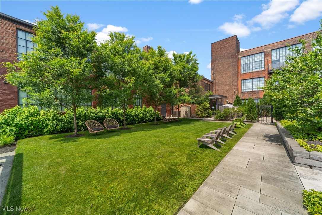 2048 Fulton Road, Unit 107 Cleveland, OH 44113 - Photo 6 of 37 Courtyard with lawn and view of the building