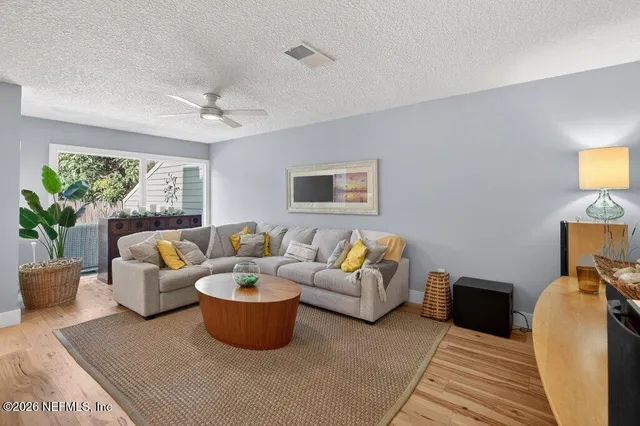 a bathroom with a toilet a sink a vanity and mirror