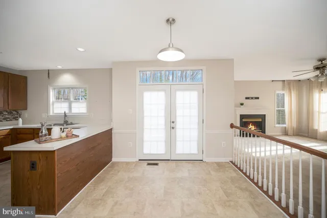 a view of a kitchen and a sink dishwasher and fireplace