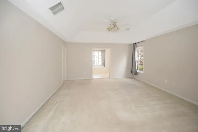 a view of empty room with windows